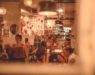 View of the inside of Taco Paco restaurant filled with guests and staff