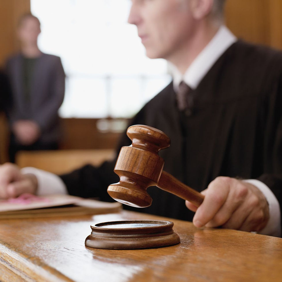 judge-holding-gavel-in-courtroom-104821184-5abb0af78e1b6e0037583b1d_edited.jpg