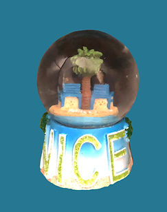 Nice snow globe with palm tree and blue chairs