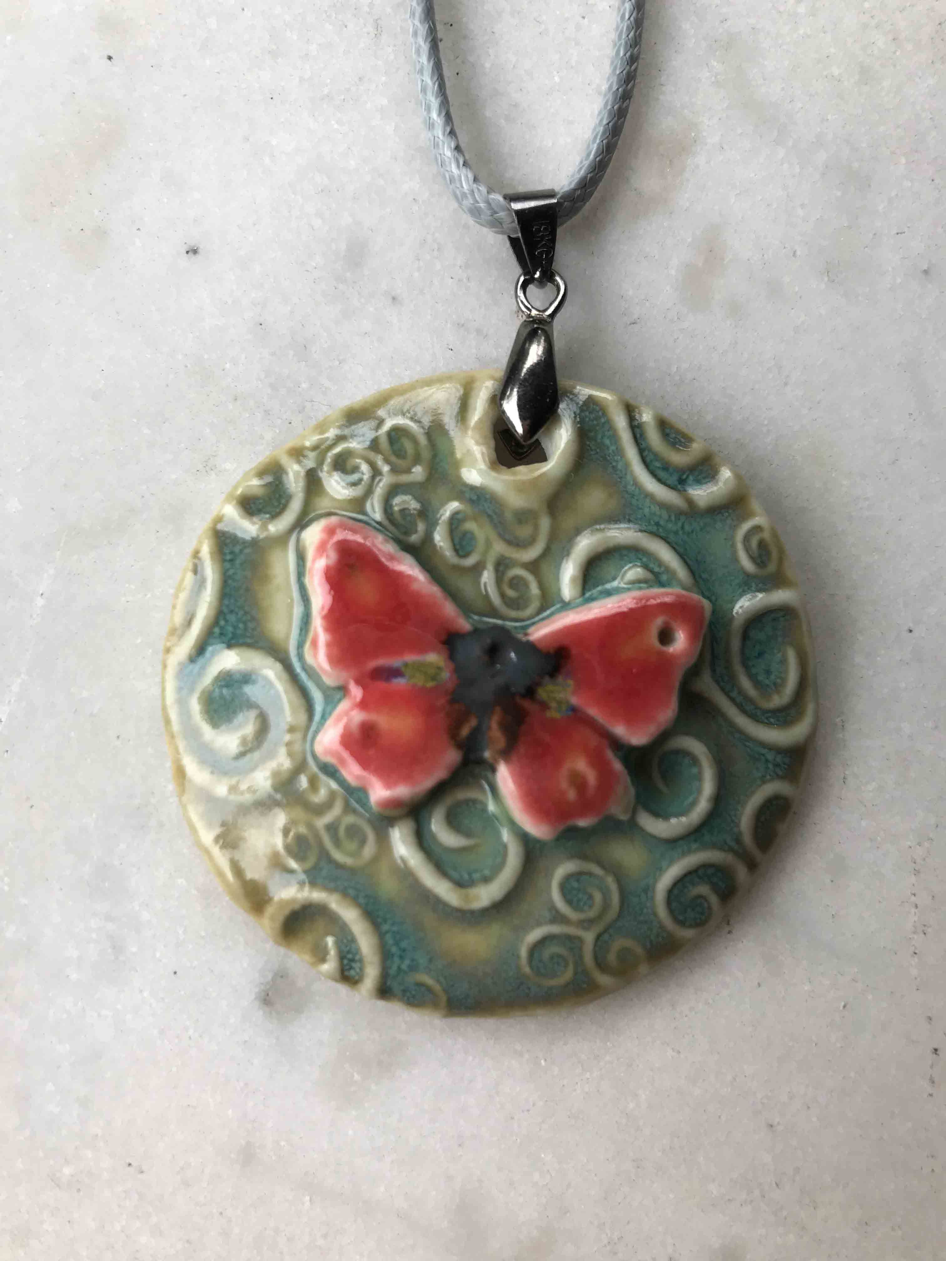 Porcelain embossed butterfly pendant