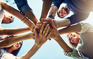 people joining hands united 