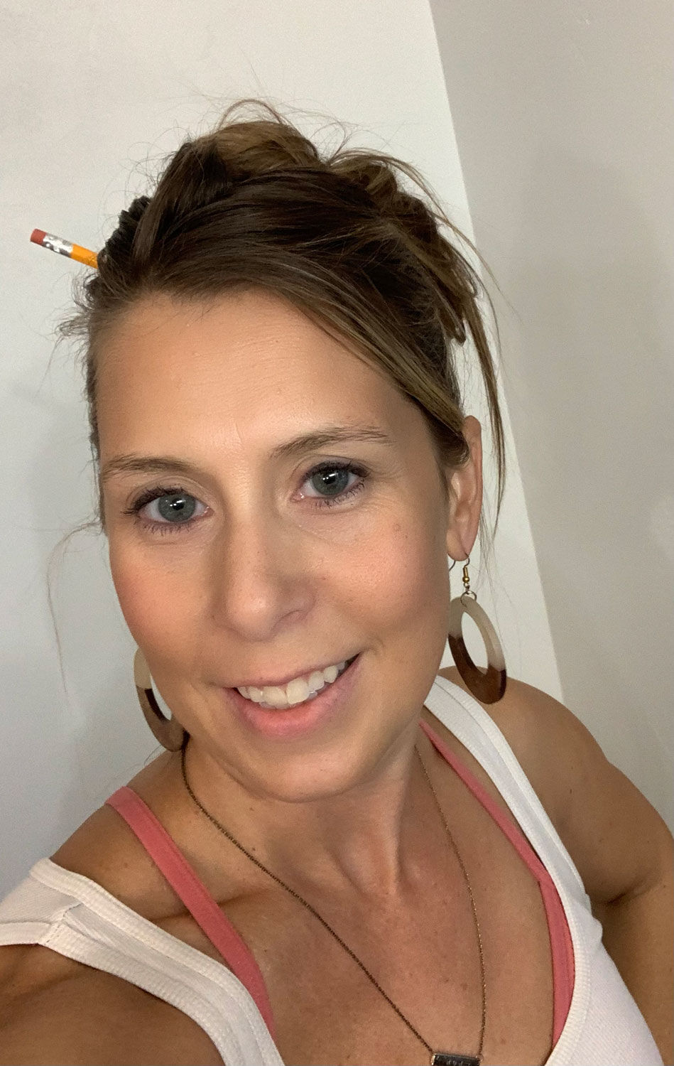 me with messy hair sporting fabulous earrings