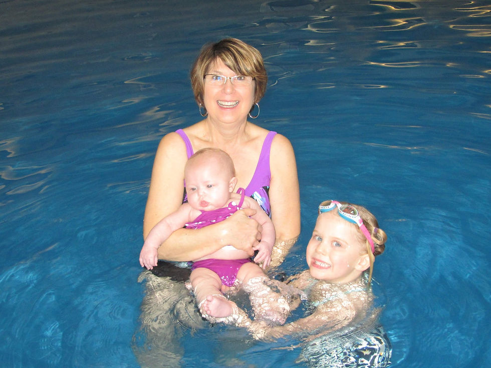 Grandma Sue holding Ava with cousin Miranda