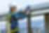 vecteezy_man-wearing-safety-equipment-next-to-solar-panels_1228835.jpg