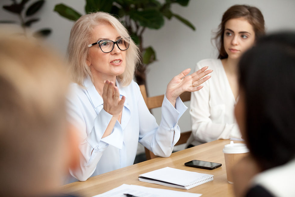 Experienced business woman speaking in a meeting.