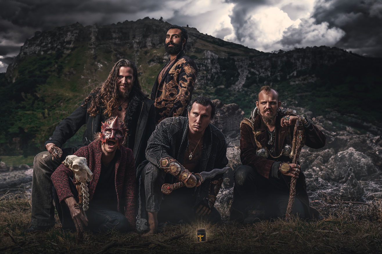 Group shot of the dark divine masculine archetype of warriors, emperors and magicians with the dark masculine natural perfume bottle