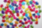 Colorful jigsaw puzzle pieces on white background. Flat lay..jpg