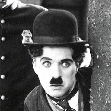 Comedian Charlie Chaplin doing slapstick comedy