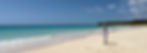 Woman walking on a pristine Caribbean beach in Quintana Roo, Mexico