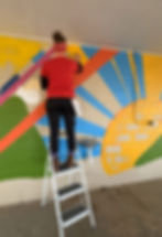 Jeanette Johnson Mural Artist works on in-progress mural in Sunny View Park Wayne Nebraska