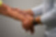 Chiropractor making an assessment of a patients arm for soft tissue treatment.