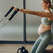pregnant-woman-exercising-with-help-reformer-pilates-class.jpg