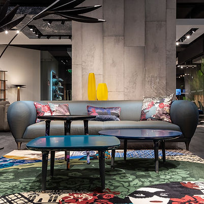 a modern living room with a cement wall