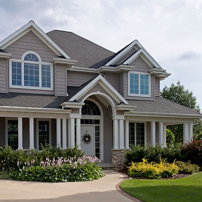 a modern home made of siding and stone
