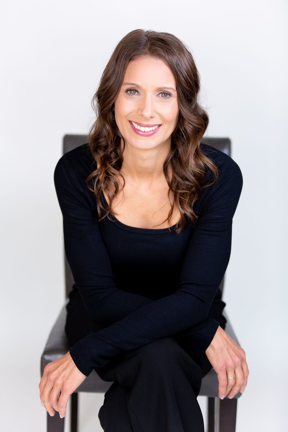 Close-up view of a well-lit business headshot with a neutral background
