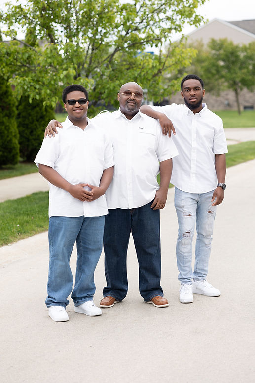 Father outside with two sons