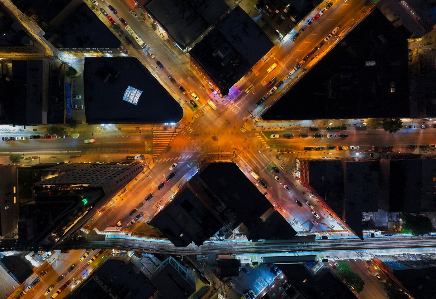 Wicker Park in Lines of Light Overhead nighttime view of a multi-way Chicago intersection and nearby railway tracks.