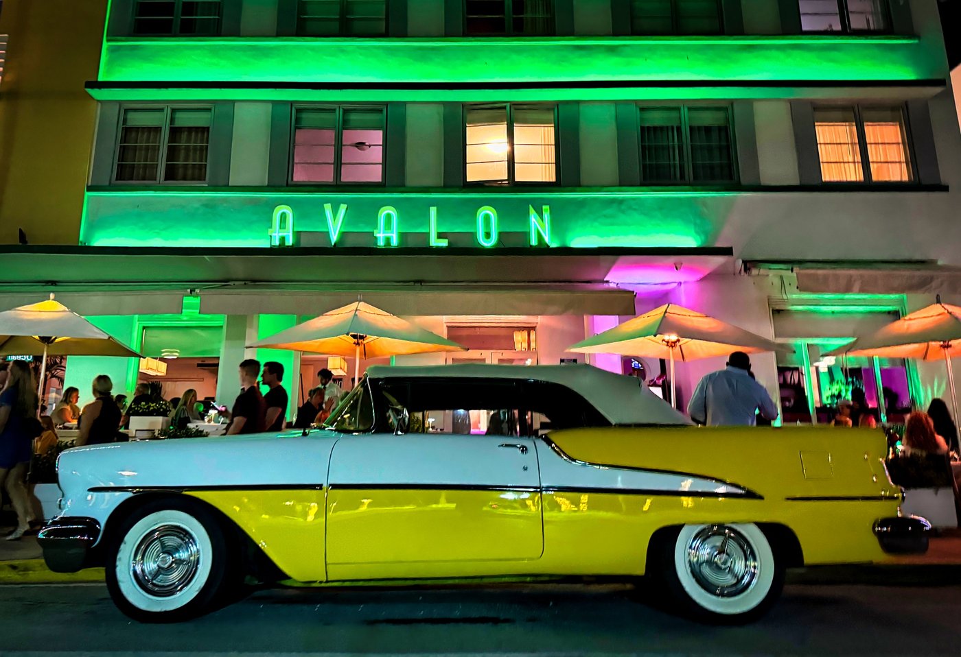 Cruisin' at the Avalon Yellow and white vintage convertible outside the neon-lit Avalon at night.