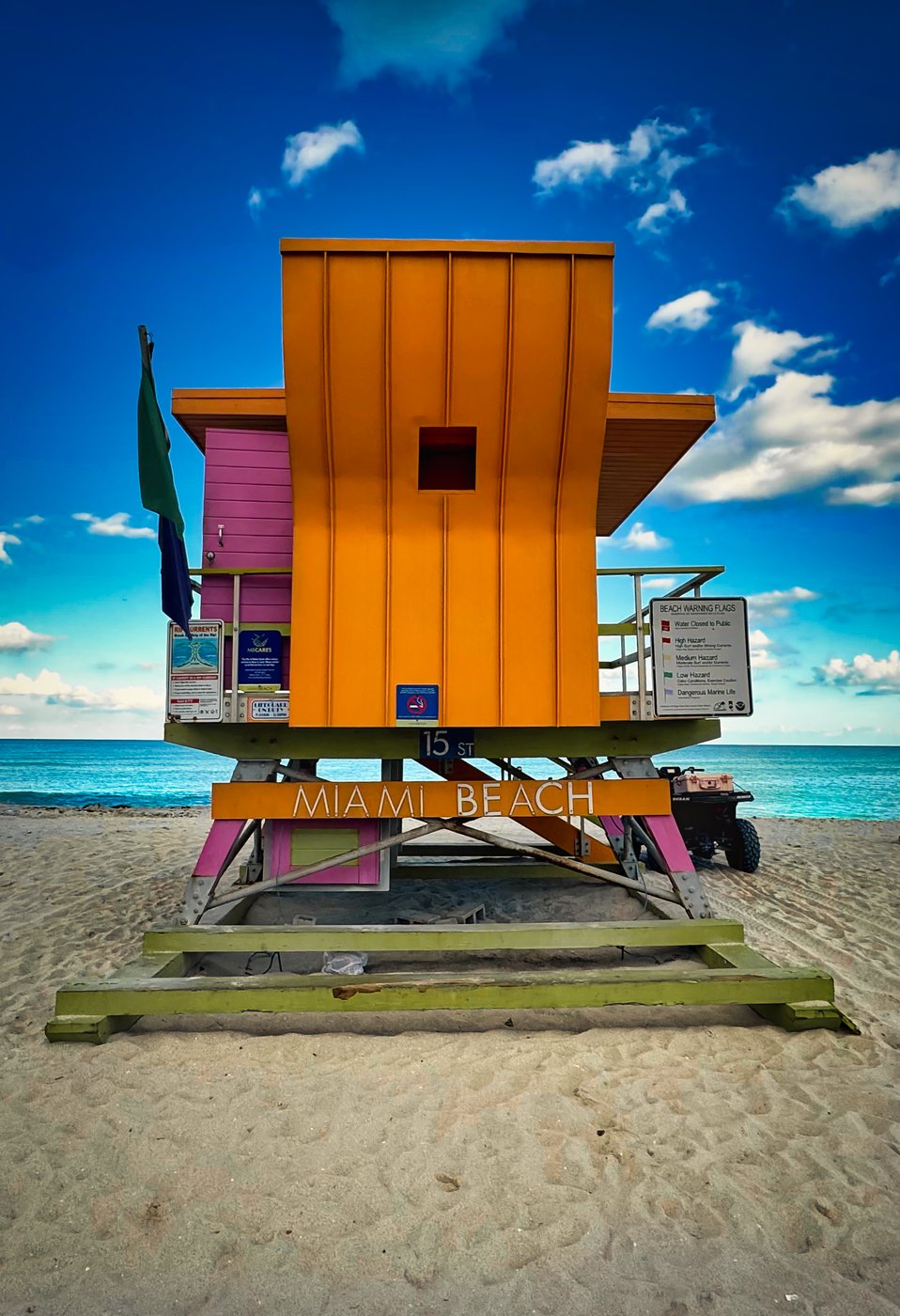 Tropical Tango on 15th Street Orange lifeguard tower with green supports and a pink side wall.