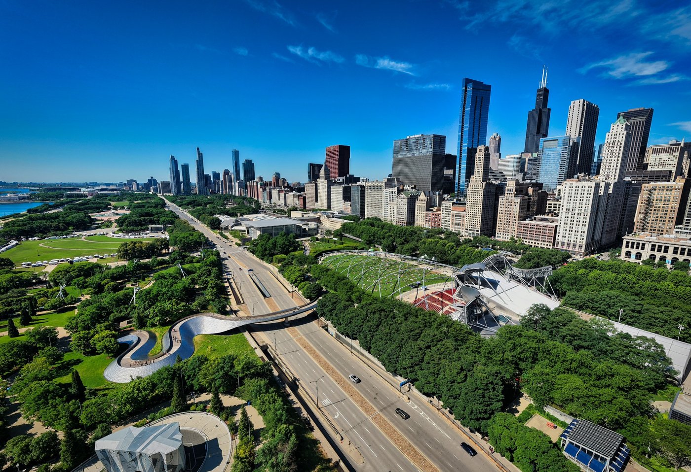 The City Beside the Park Elevated view of Chicago lakefront roadway, green parkland, and downtown buildings.