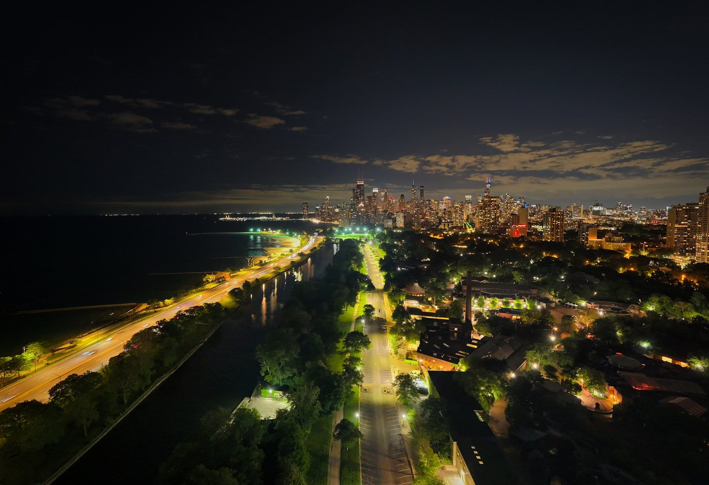 Shoreline After Hours Chicago shoreline and road illuminated at night beside the dark lake.