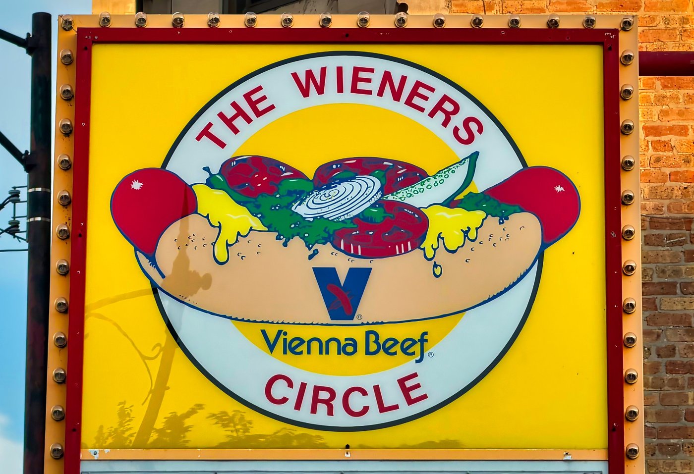 The Wiener's Circle Yellow Wiener's Circle sign with hot-dog illustration and Vienna Beef lettering.