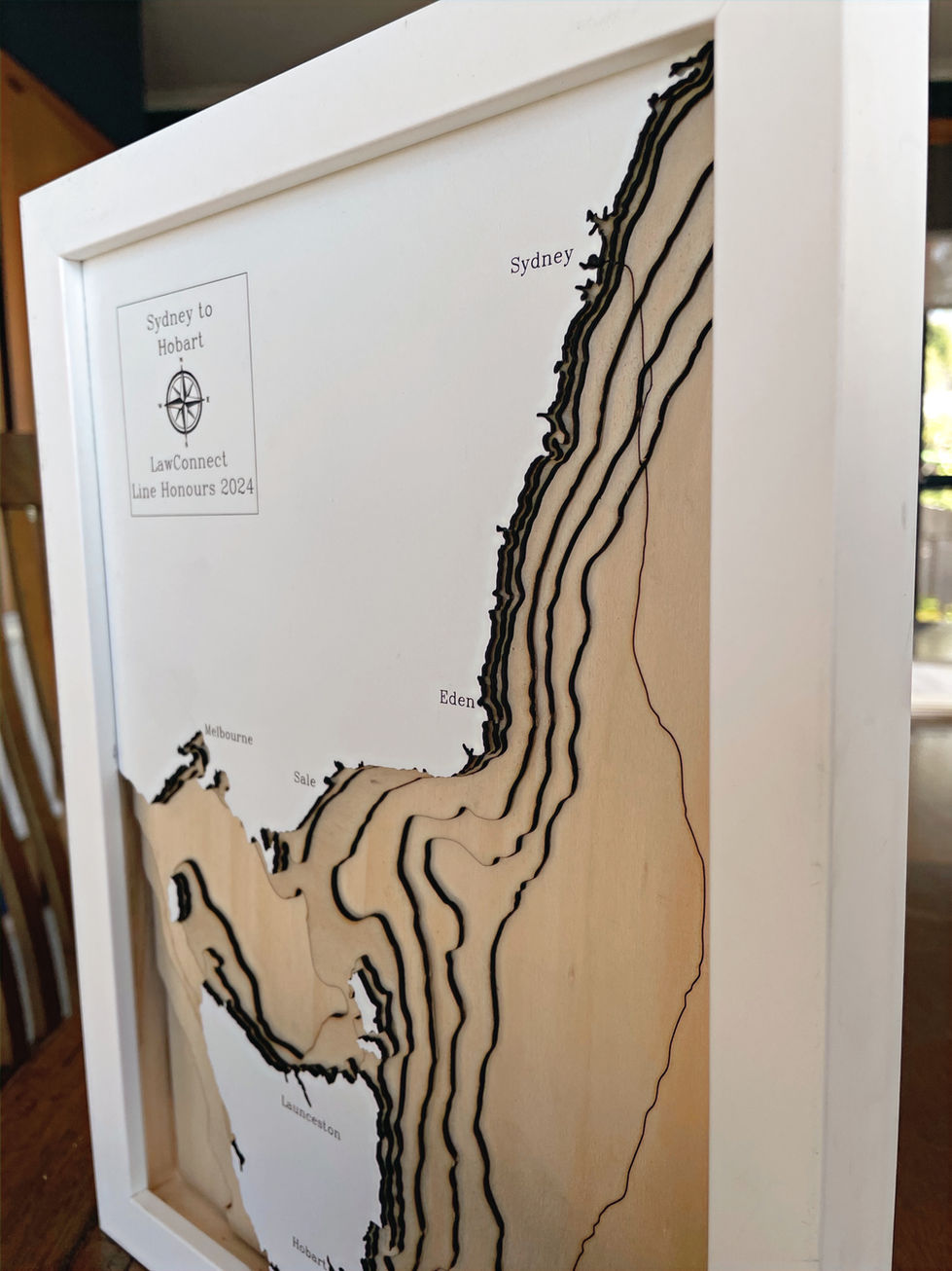 A 3D wooden topographic and bathymetric map of the 2024 Sydney to Hobart yacht race focusing on South East Australia
