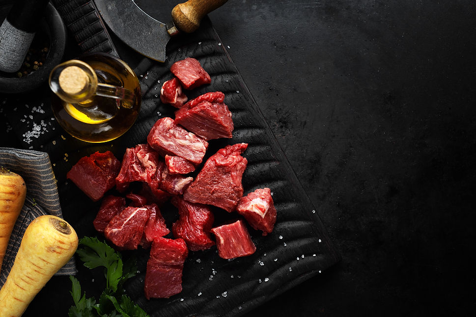 beef-chunks-with-ingredients-served-table.jpg
