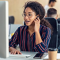 young-woman-working-at-computer-in-busy-office-2026-01-05-00-53-47-utc.jpg