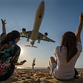 airplane-flying-low-over-beach-with-people-waving-2026-03-10-04-03-53-utc.jpg