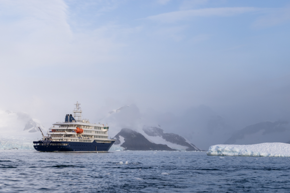An image of the MV Hondius cruise ship navigating through icy waters in Antarctica