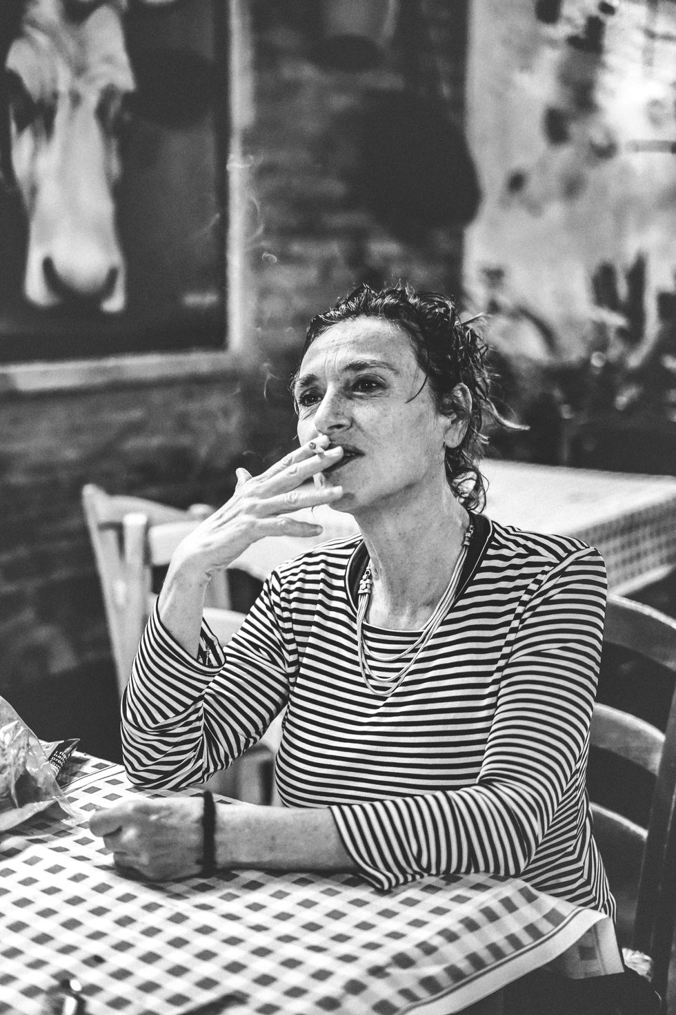 Italian wife and pizzaria owner during her break
