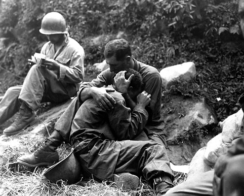 Korean medic comforting a soldier with "shell shock'' (PTSD)