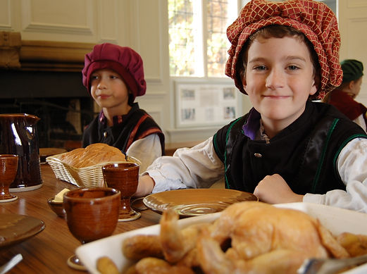 tudor banquet table boys in costume.jpg