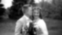 Black and white blurry vintage video of cute couple on their wedding day in a forest