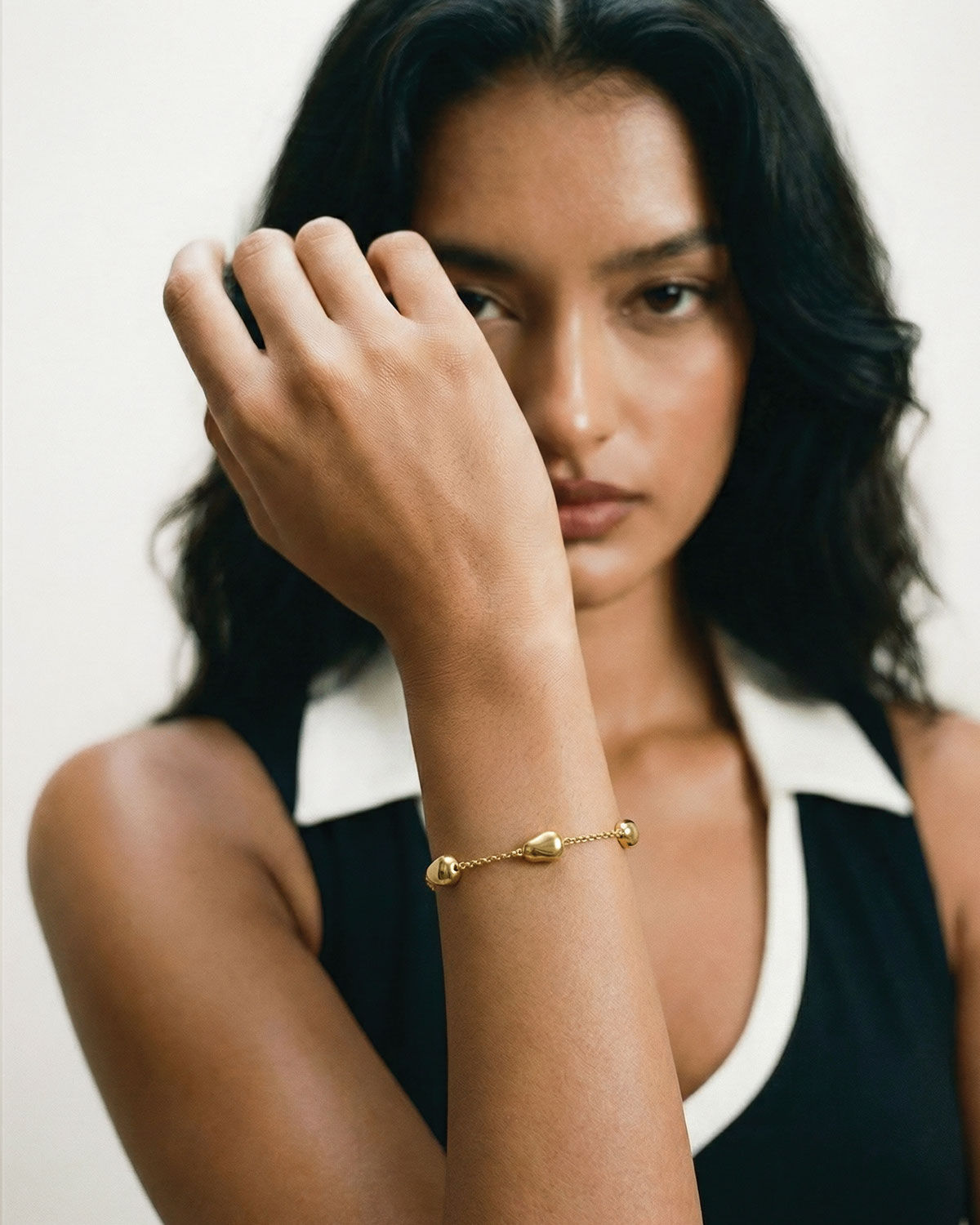 River Stones Bracelet demi-fine 24k gold bracelet worn on the wrist — June Gold Forming™