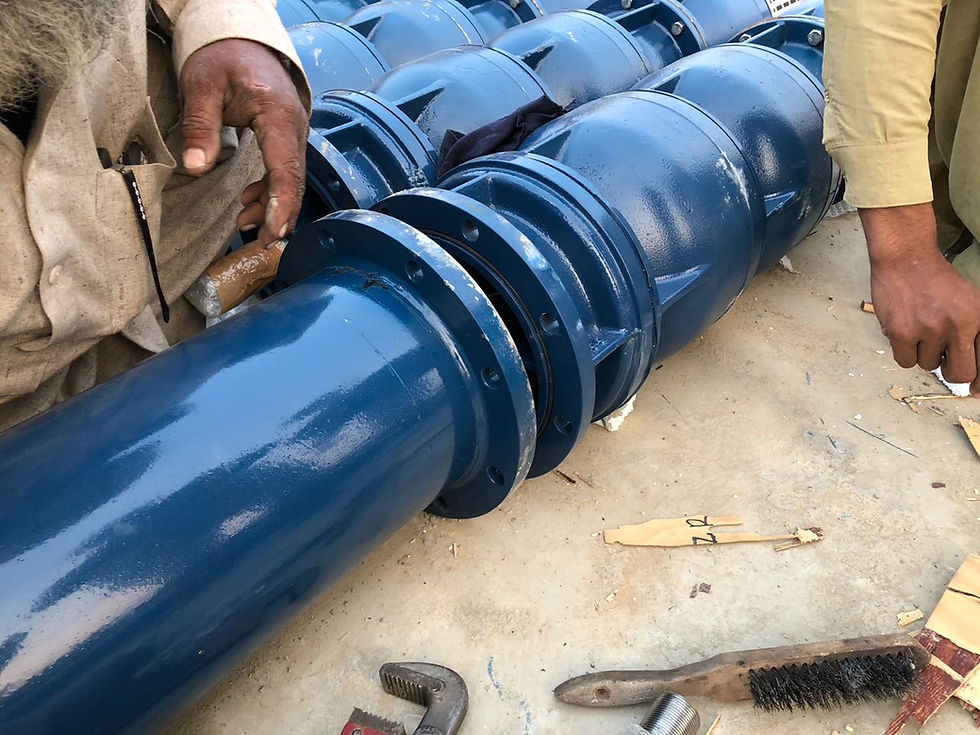 Thumbnail: Detail of blue flanged pipe connections on a VP series pump during field assembly.