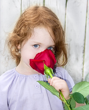 Child Holding Rose