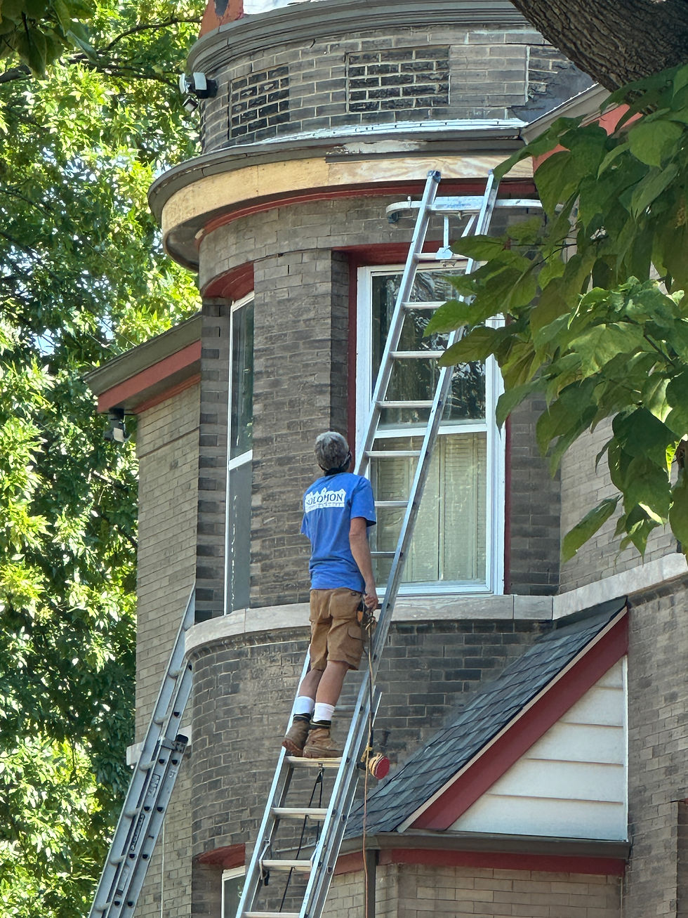 Close-up view of a contractor installing new shingles on a roof