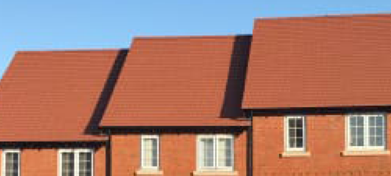 Three terraced houses, with brown gemini Interlocking Concrete Roof Tiles