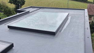 Image of window roof on a flat black roof