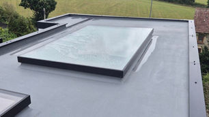 Image of window roof on a flat black roof