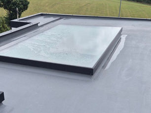 Image of window roof on a flat black roof