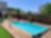 Piscine coque rectangulaire terrasse bois.png