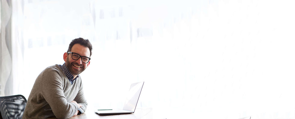 happy-businessman-smiling-with-laptop-2021-08-28-01-03-54-utc (1).jpg