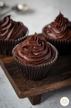 Chocolate cupcakes on a stand ready to sellSpoon and Fork Food Photography 