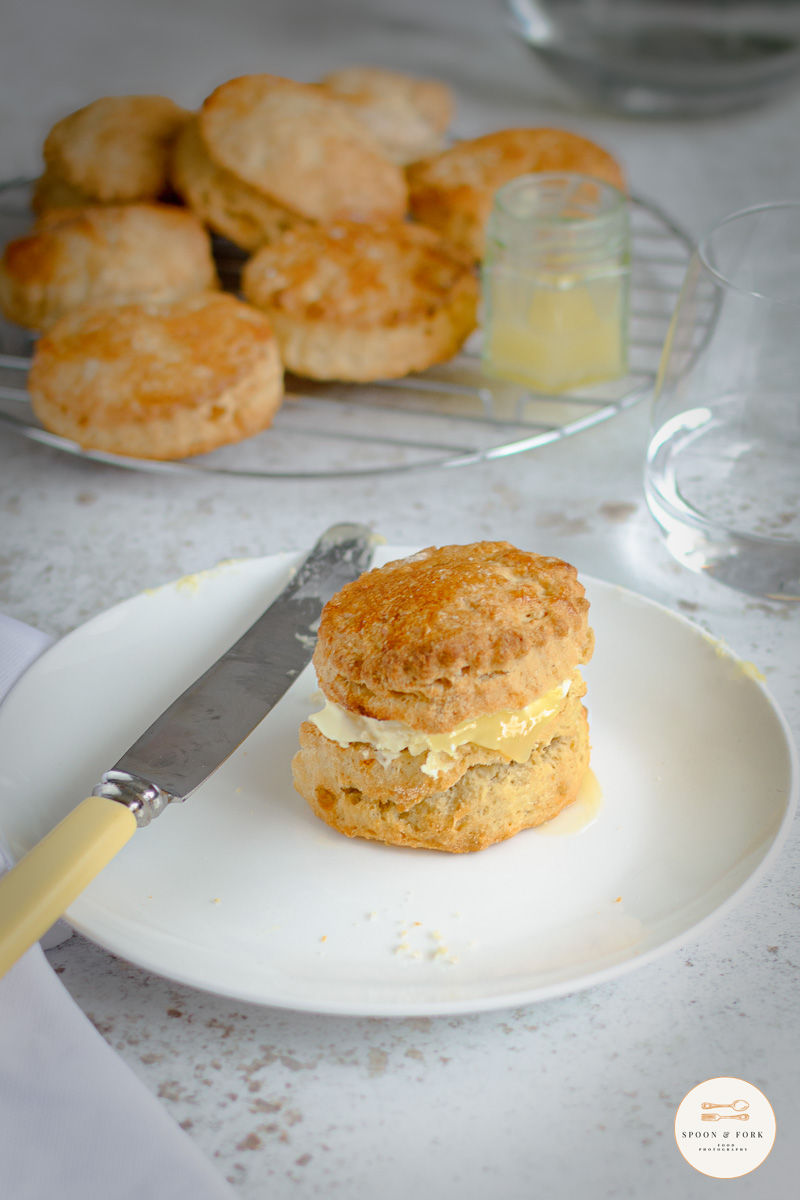 A ginger scone served with clotted cream and lemon curd