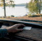 Hand holding Minnesota auto insurance proof card