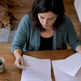 Homeowner comparing insurance and warranty contracts