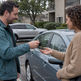 Owner hands car keys to a friend